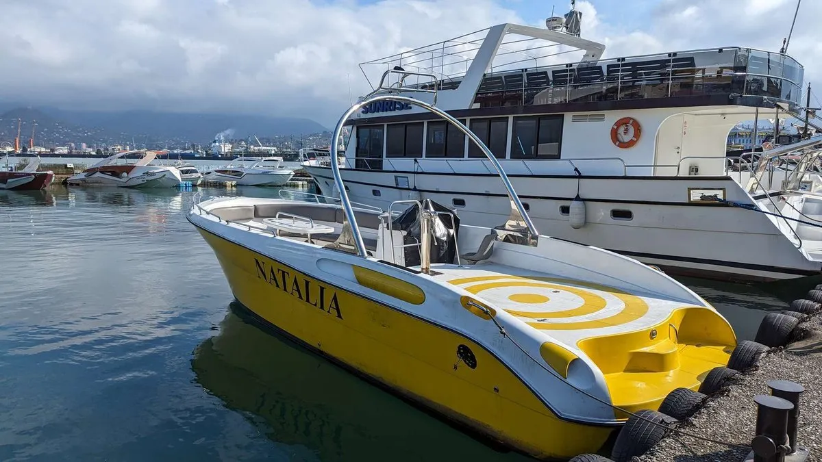 Parasailing on Natalia boat - yellow hull by the boulevard Parasailing on Natalia boat - yellow hull by the boulevard